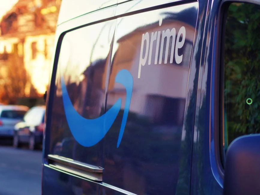 Brand manager reviewing Amazon ad performance data after Prime Day to plan holiday campaign strategy for October shoppers