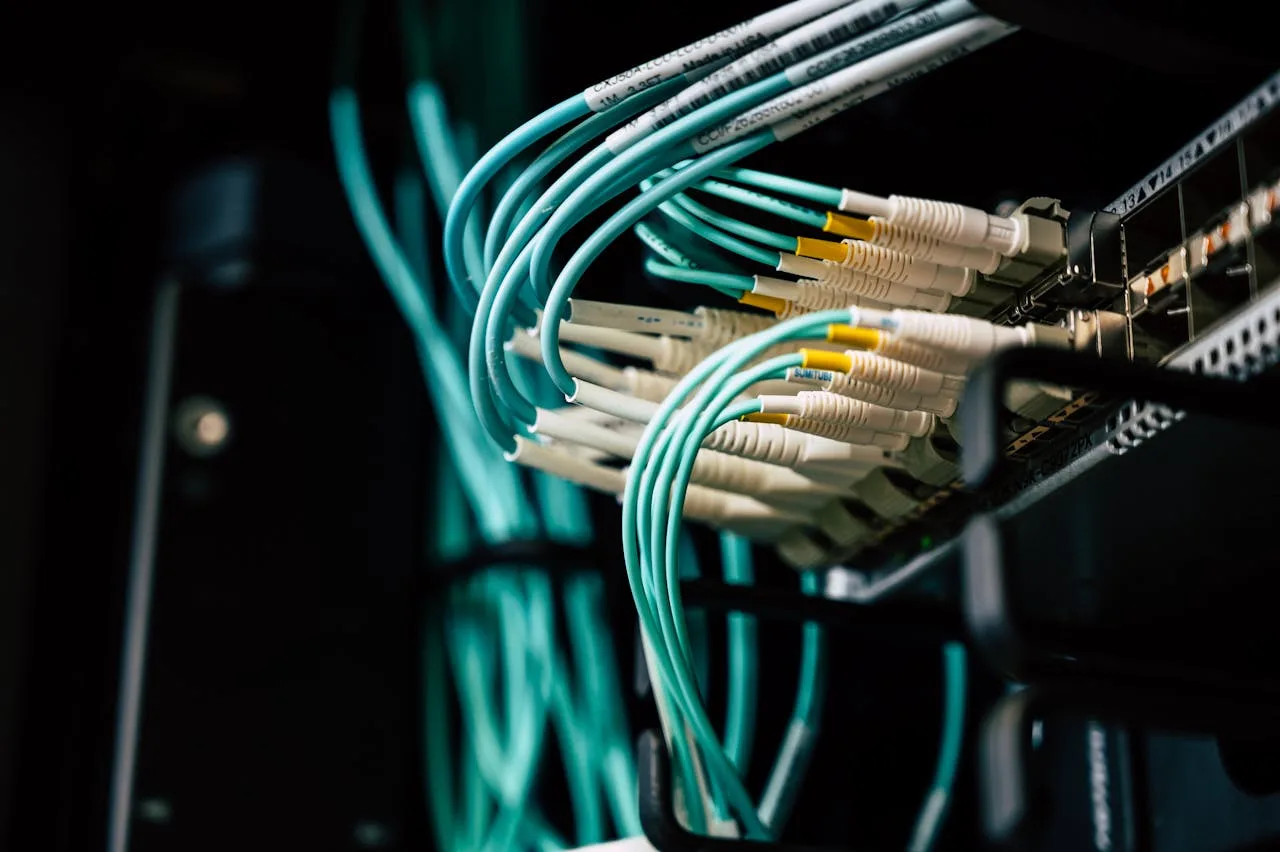 Dark server room with blue network lights illustrating Anthropic Mythos AI cybersecurity model and Project Glasswing restricted access tier